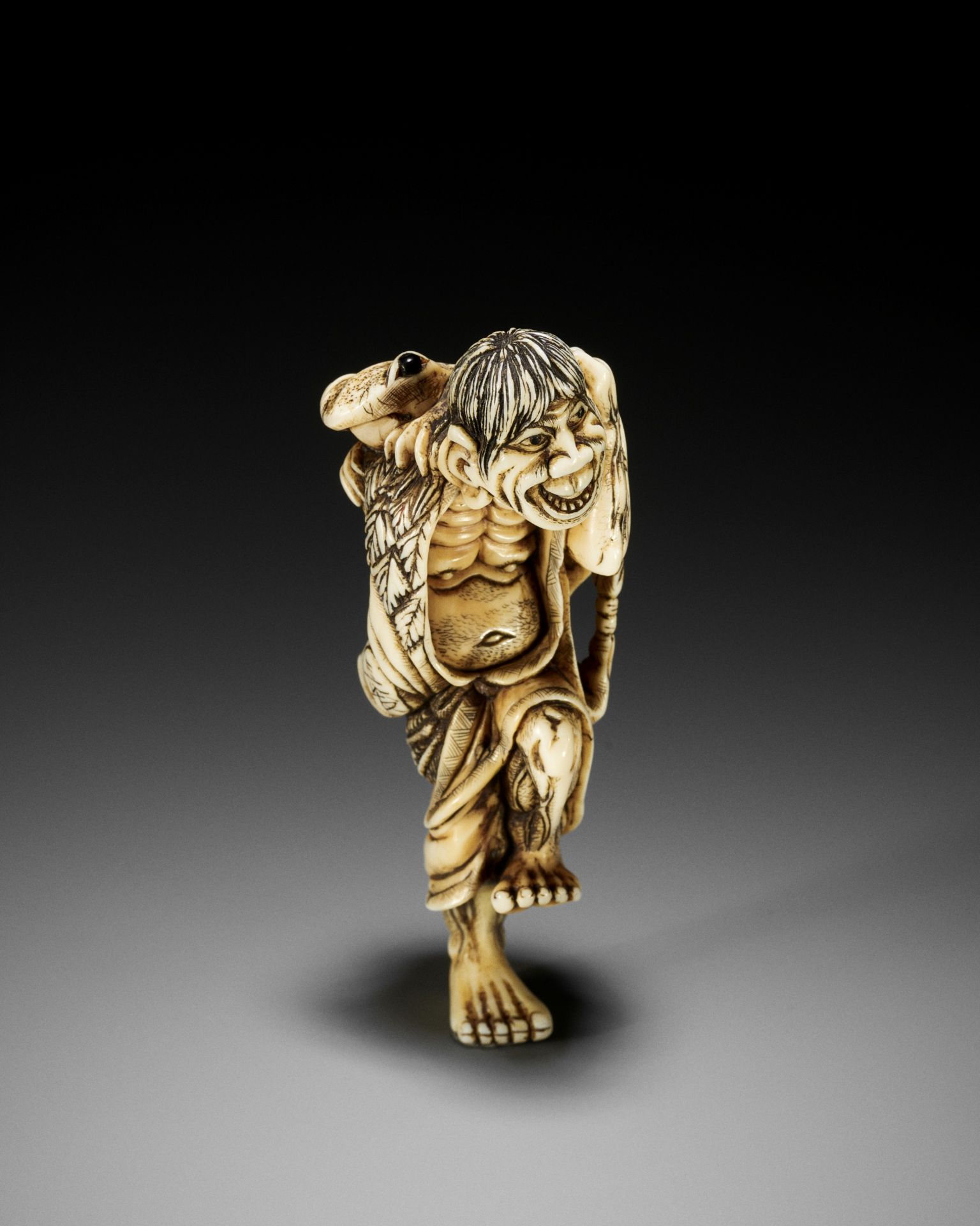 NAGATOMO: A LARGE IVORY NETSUKE OF GAMA SENNIN AND HIS TOAD