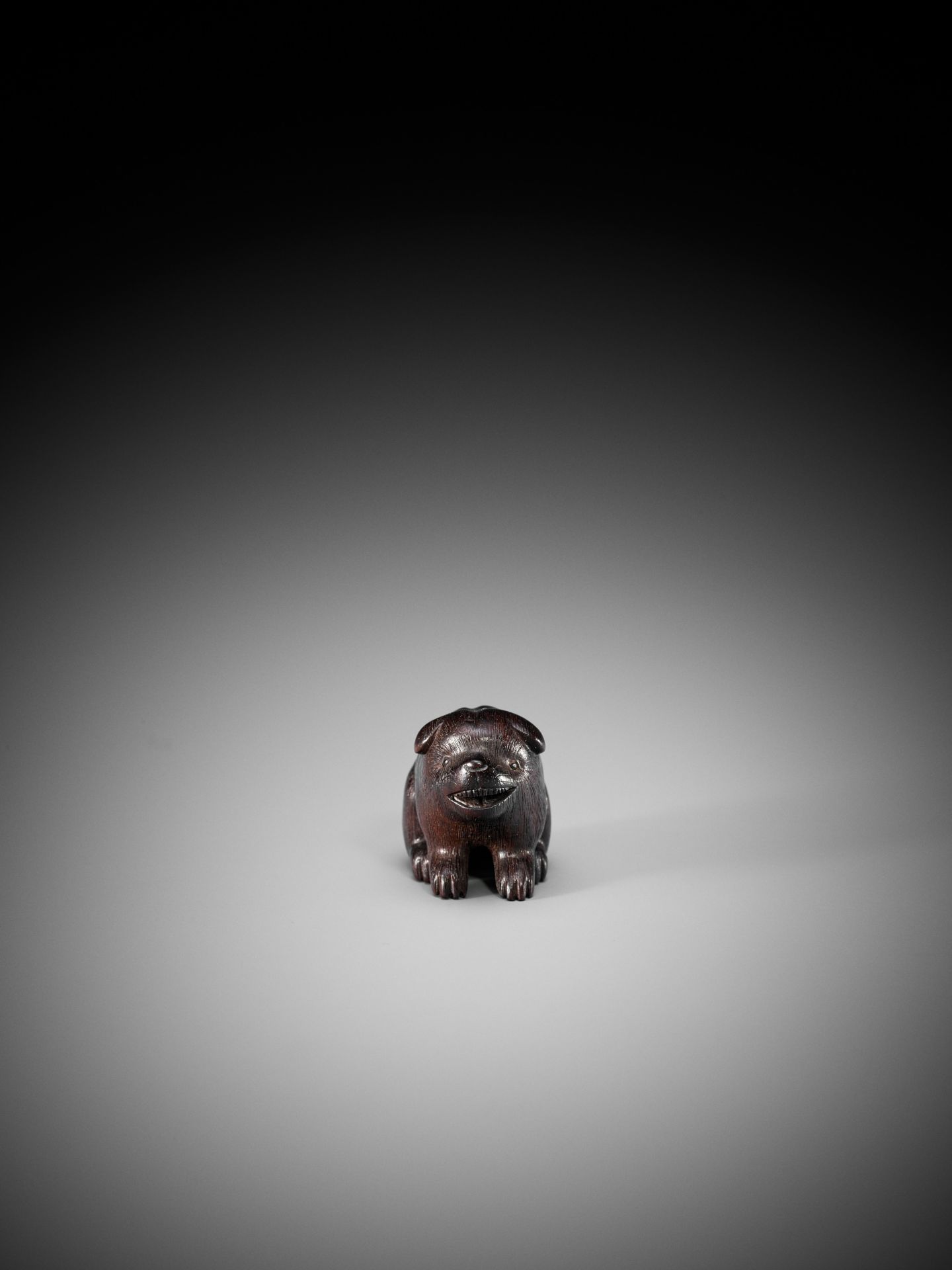 RANICHI: A DARK WOOD NETSUKE OF A PUPPY - Bild 2 aus 9