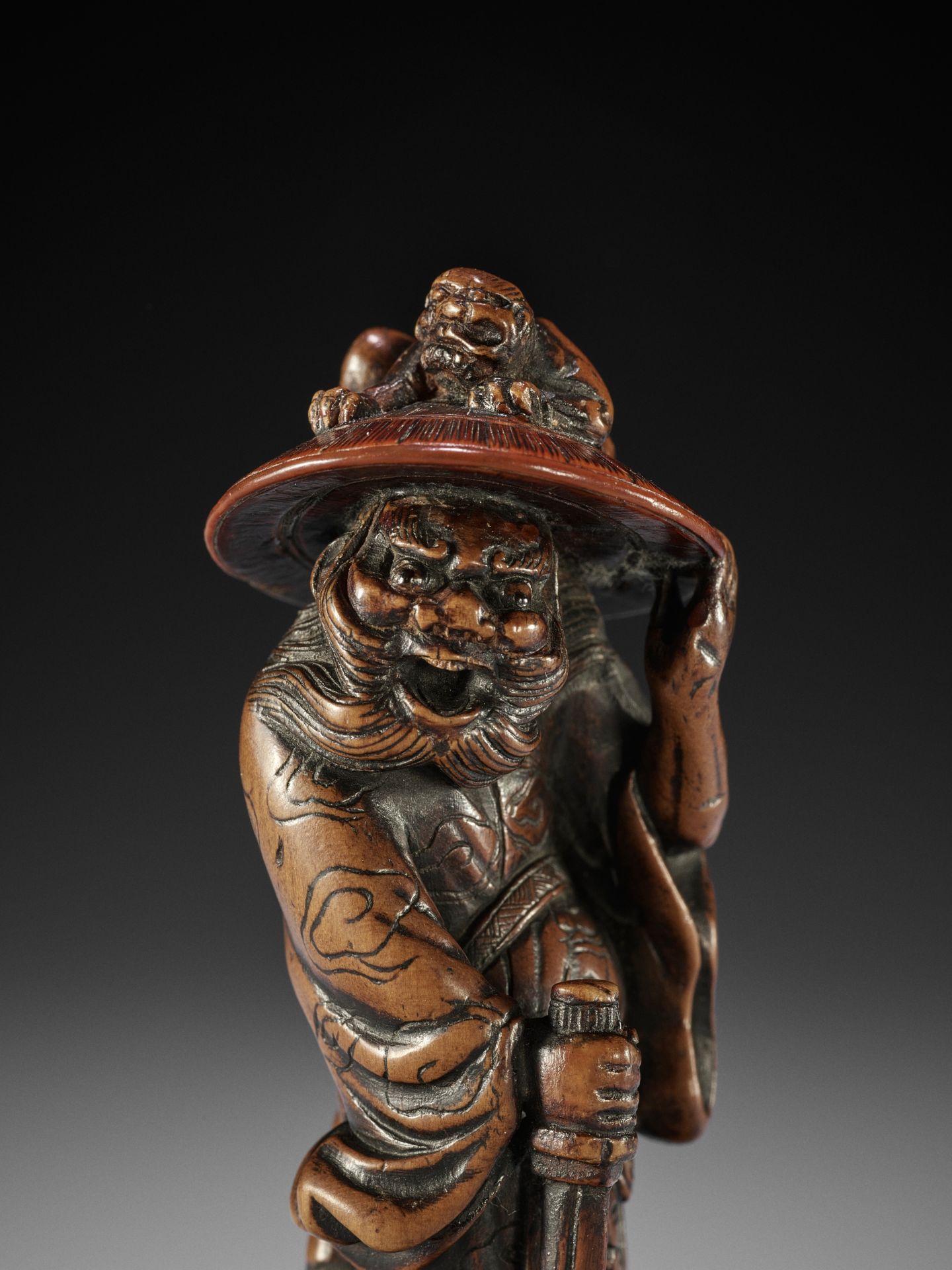 MITSUHARU: A SUPERB WOOD NETSUKE OF SHOKI AND ONI