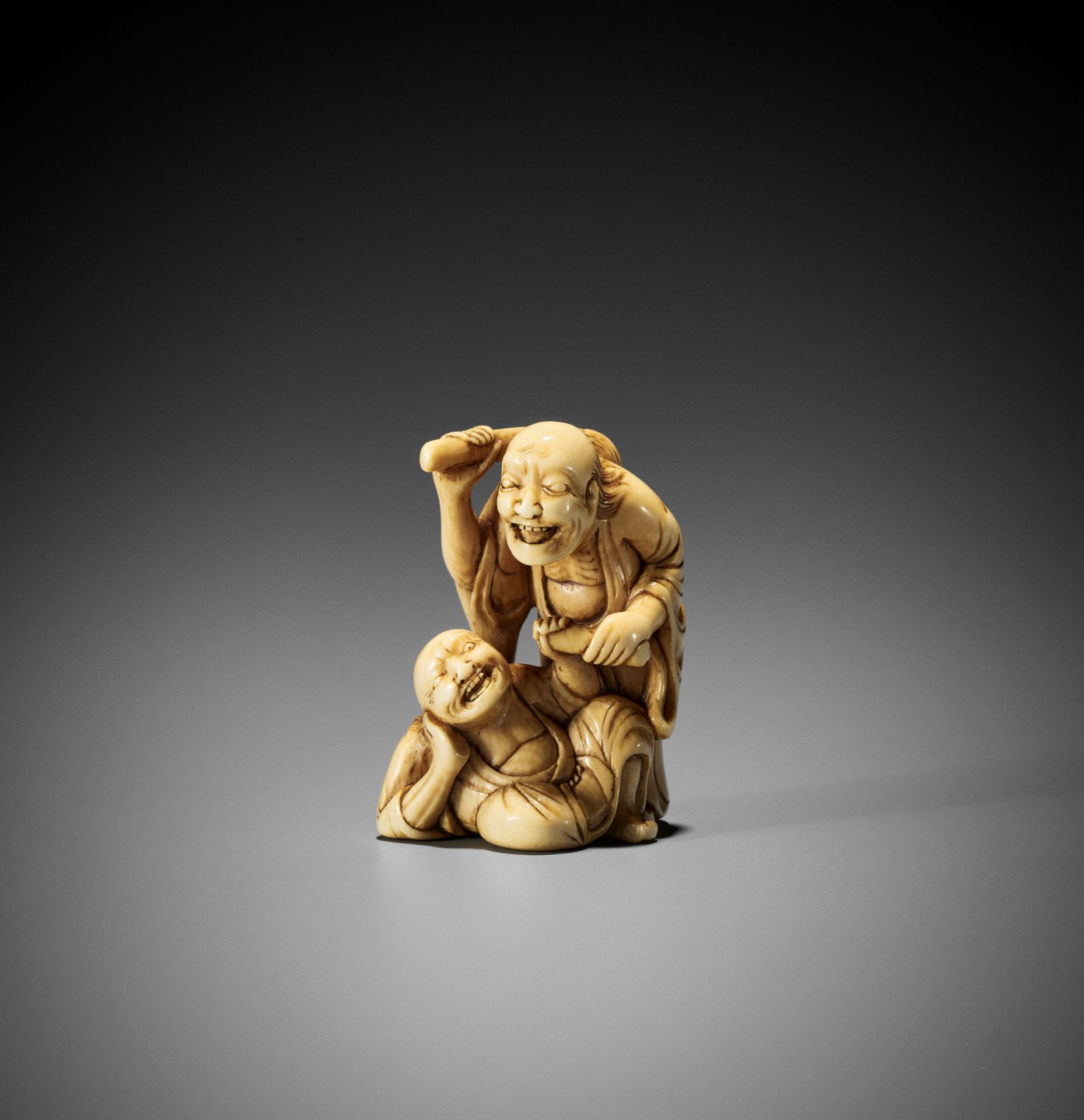 AN IVORY NETSUKE OF TWO SAGES