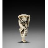 A GOOD IVORY NETSUKE OF SHOKI, ATTRIBUTED TO MITSUHARU