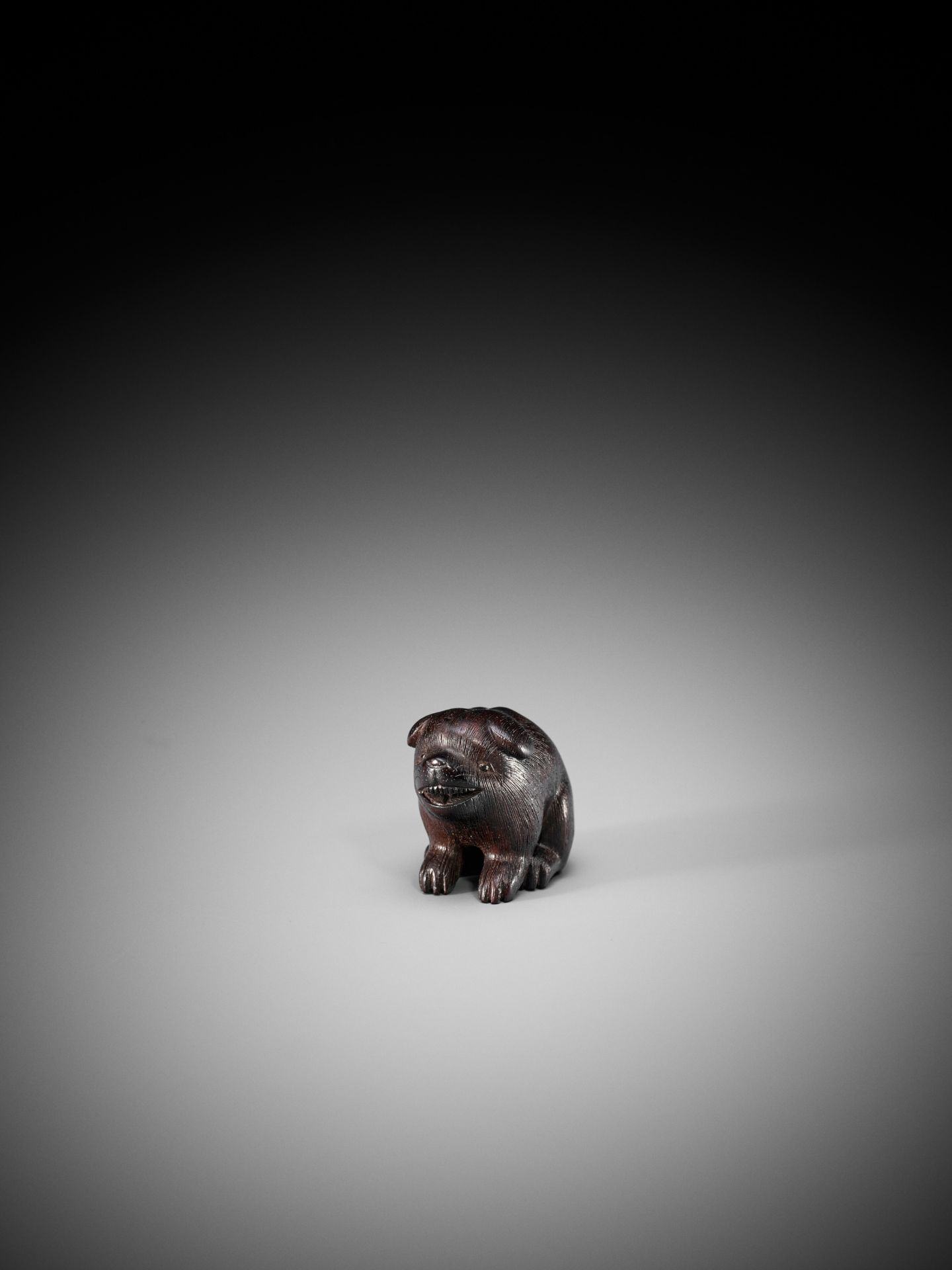 RANICHI: A DARK WOOD NETSUKE OF A PUPPY - Bild 3 aus 9