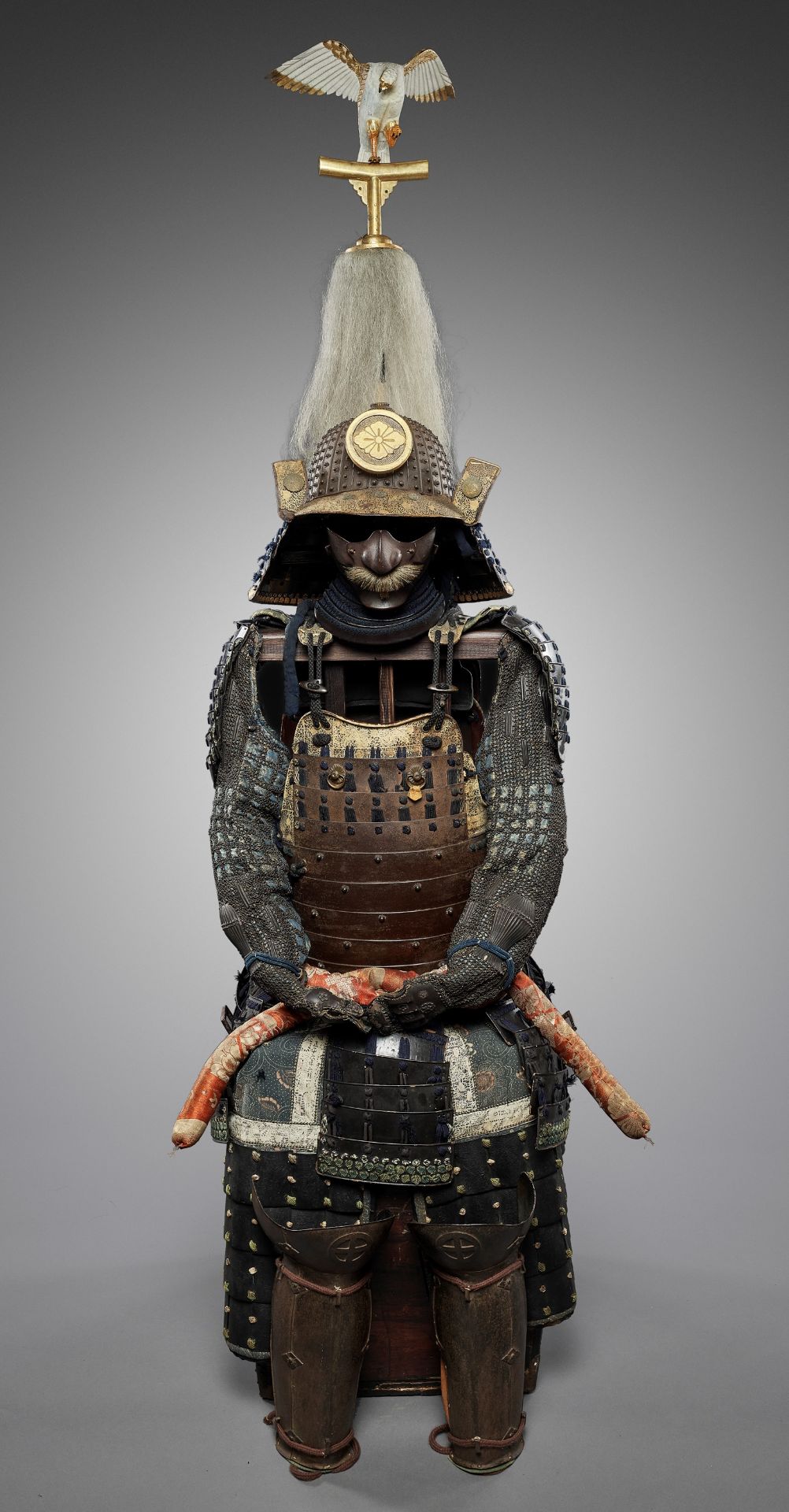 A SUIT OF ARMOR WITH A SUJIBACHI KABUTO BY KATSUHISA MYOCHIN AND A FALCON SASHIMONO
