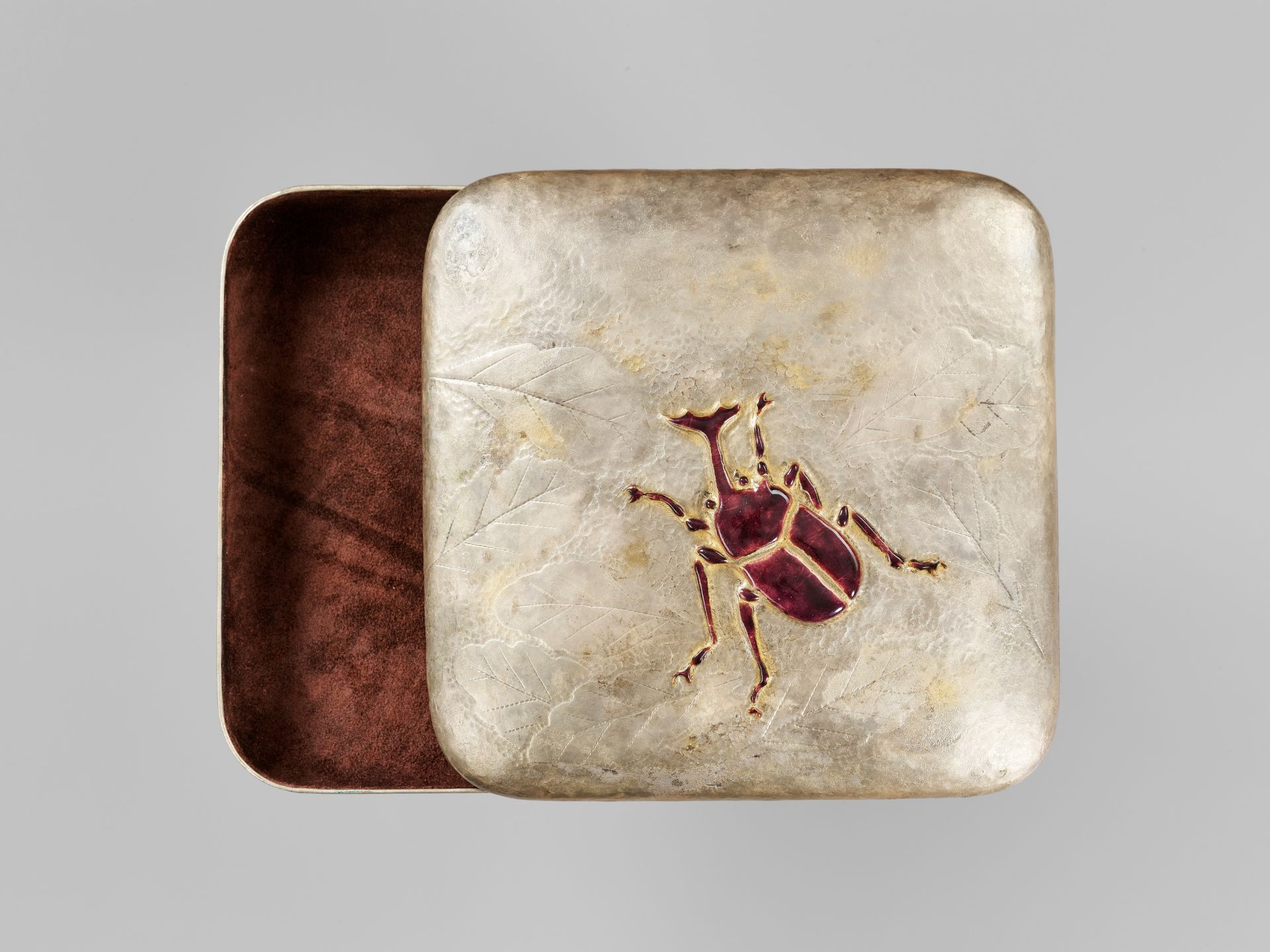 SANO HIROSHI: A CERAMIC-INLAID SILVERED-METAL BOX AND COVER WITH A STAG BEETLE