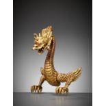 A RARE GOLD-LACQUERED WOOD MAEDATE IN THE FORM OF A DRAGON