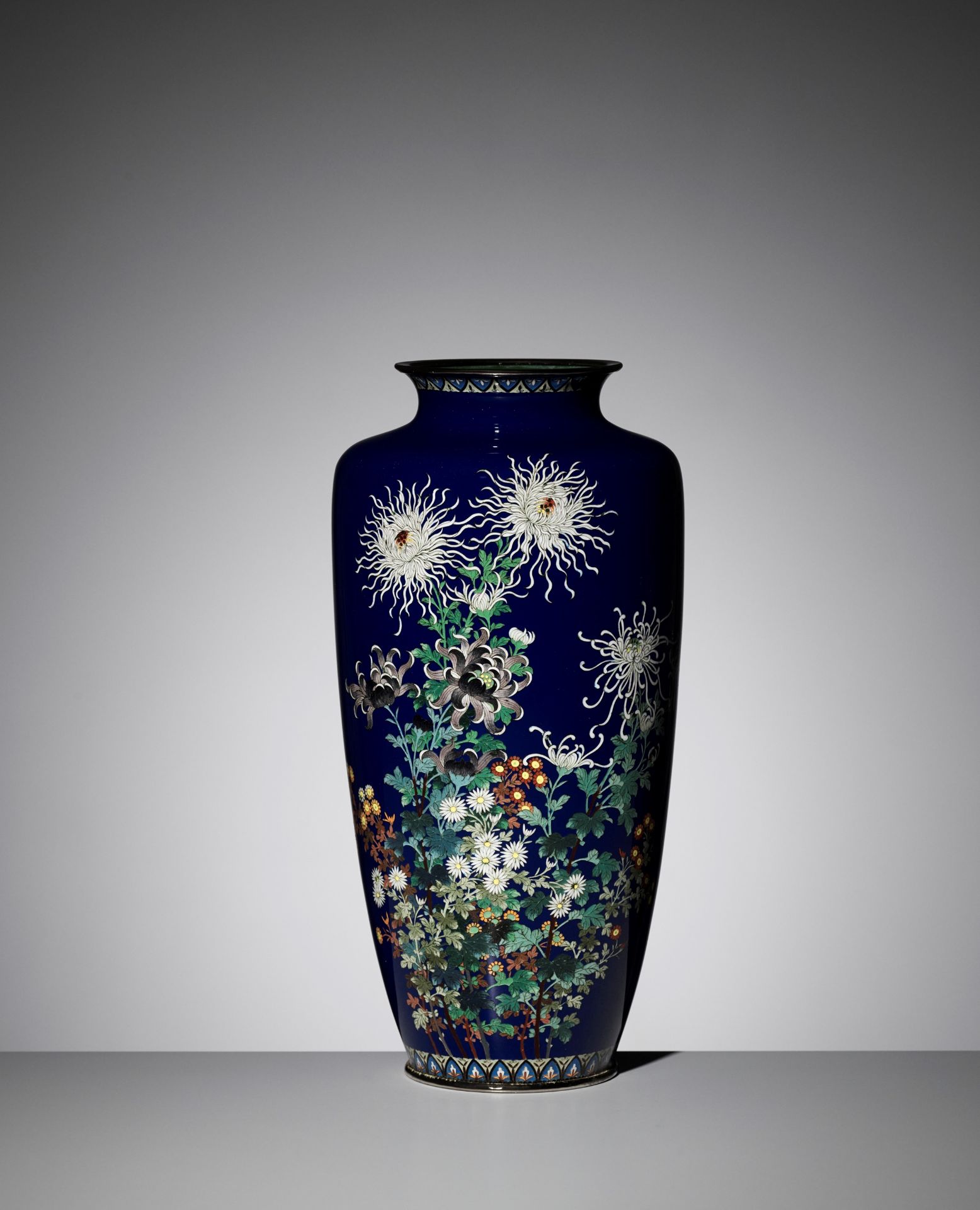 A LARGE MIDNIGHT-BLUE CLOISONNÃ‰ VASE WITH FLOWERS