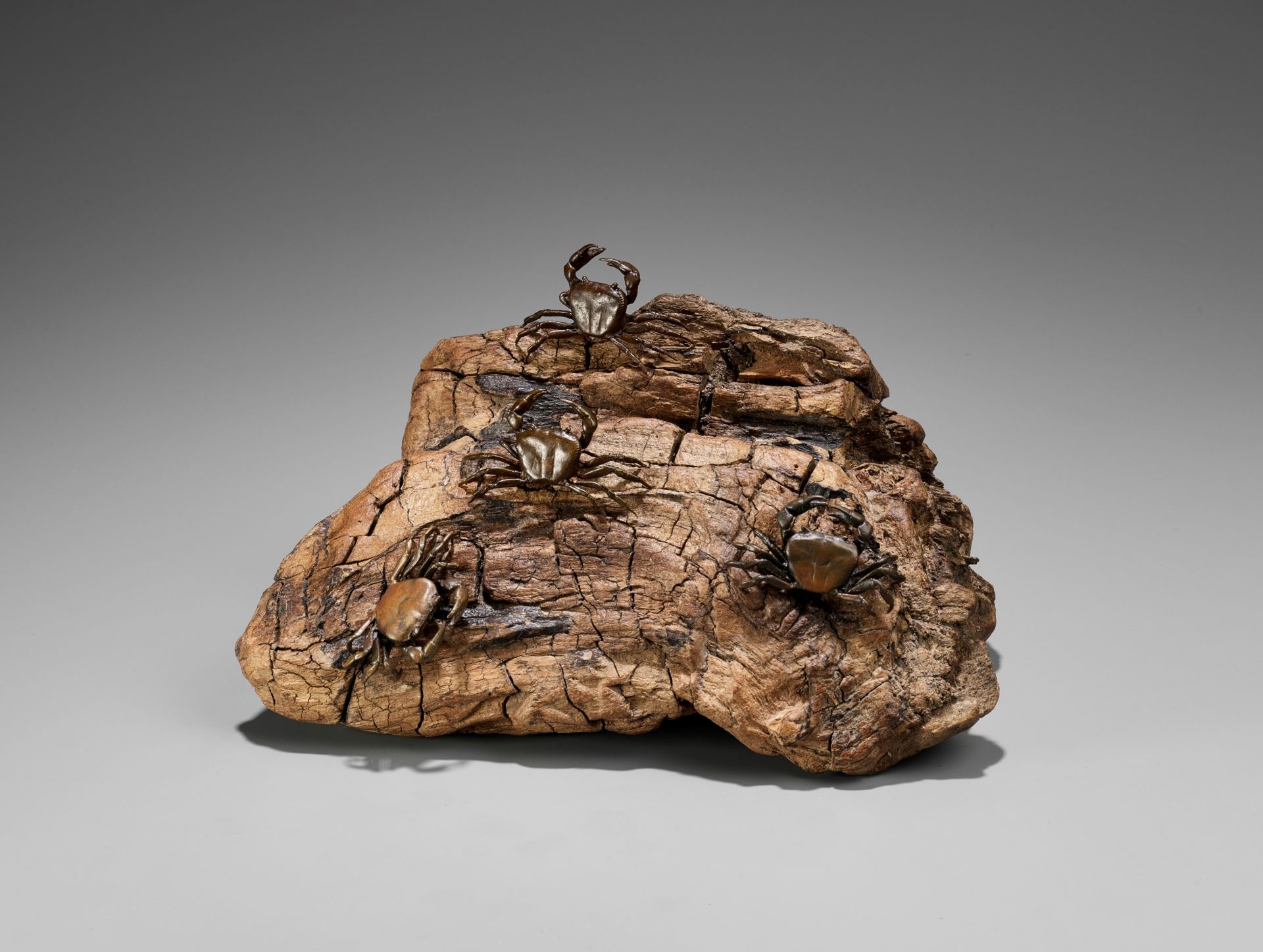 AN UNUSUAL BRONZE AND ROOTWOOD OKIMONO OF A CRAB ROCK