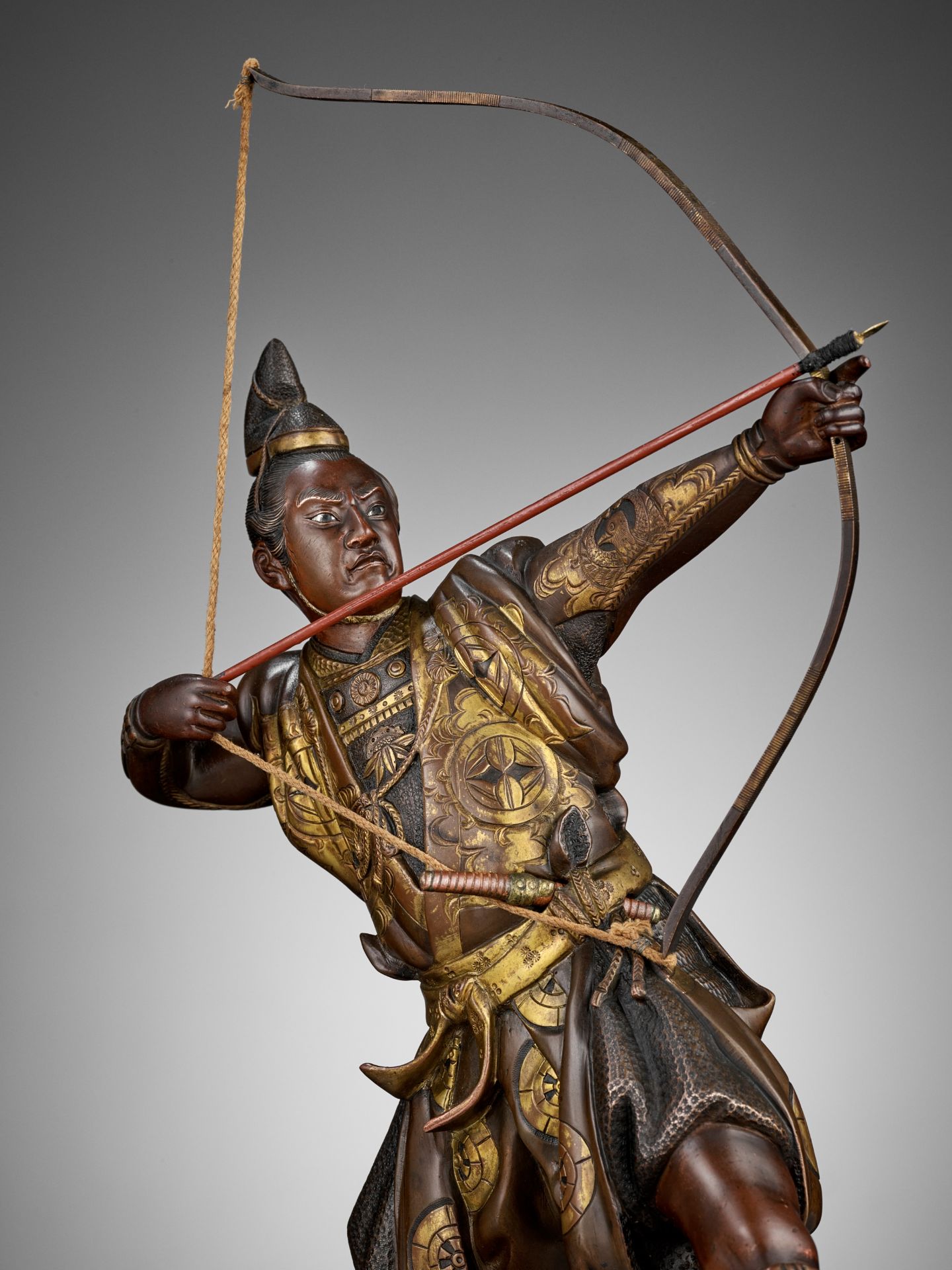 KOICHI: A PARCEL GILT BRONZE FIGURE OF AN ARCHER