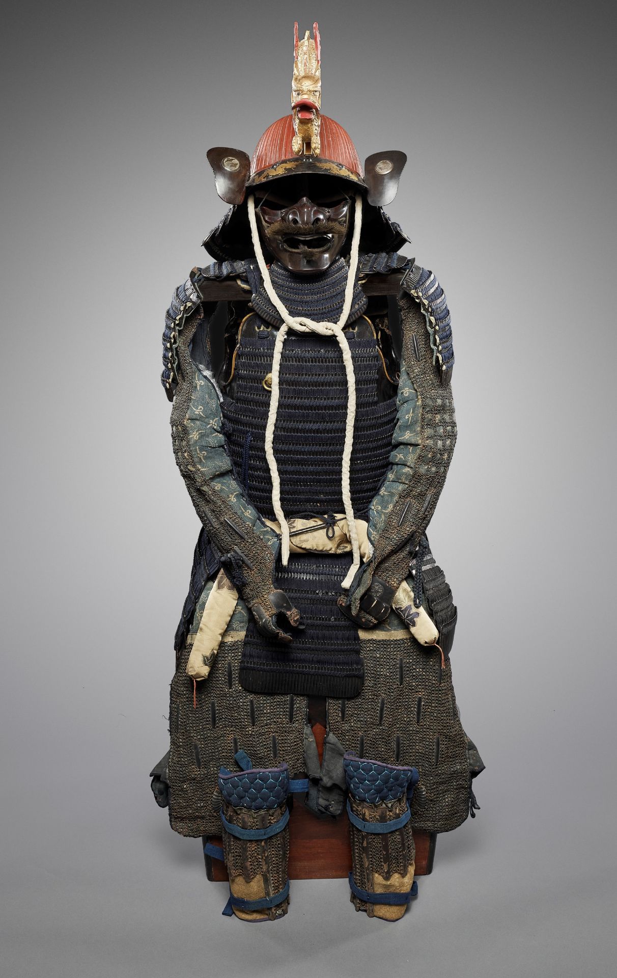 A SUIT OF ARMOR WITH SUJIBACHI KABUTO AND LARGE DRAGON MAEDATE