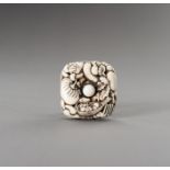 A SQUARED IVORY RYUSA MANJU NETSUKE