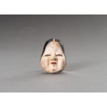 A SAISHIKI WOOD MASK NETSUKE OF OKAME