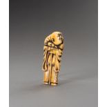 A FLAT IVORY NETSUKE OF A PEASANT