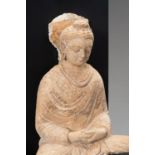 A STUCCO FIGURE OF BUDDHA, GANDHARA