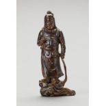 A GILT AND LACQUERED WOOD FIGURE OF A HEAVENLY KING, MING