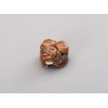 MITSUHIRO: A WOOD NETSUKE OF THREE SNAILS ON A SHIMEJI MUSHROOM