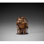 A LARGE WOOD SHUNGA NETSUKE OF OKAME