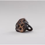 A LACQUERED WOOD NETSUKE OF A LOTUS POD