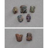 A GROUP OF 7 SMALL BACTRIAN HEADS