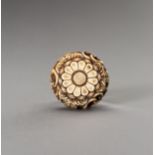 AN IVORY RYUSA MANJU NETSUKE WITH KIKU BLOSSOMS