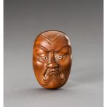 HOZAN: A WOOD NETSUKE OF A BAKEMONO MASK