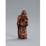 A WOOD NETSUKE OF KAN'U