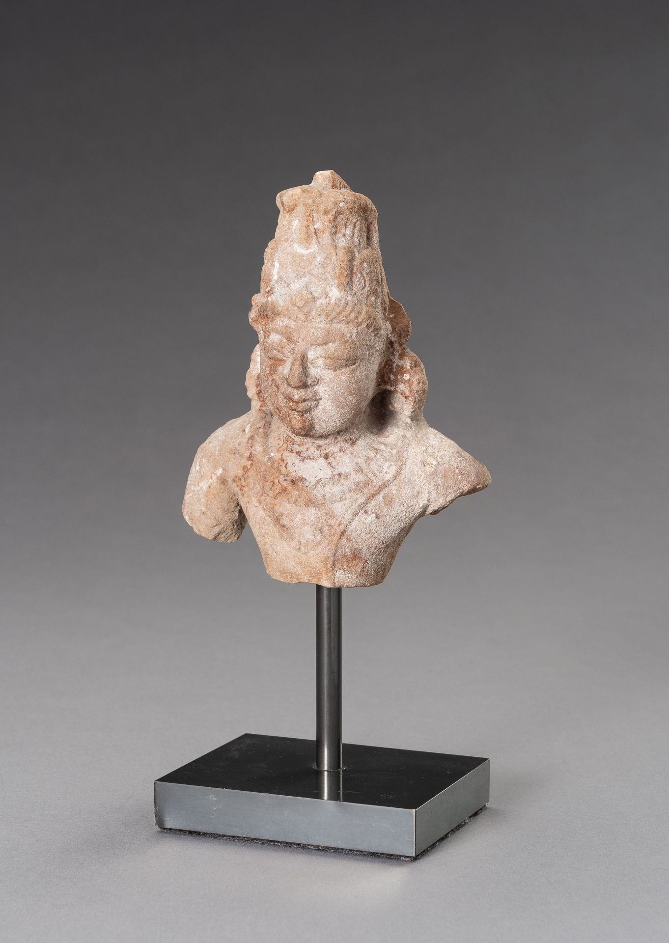 A SMALL SANDSTONE BUST OF SHIVA, 12TH CENTURY