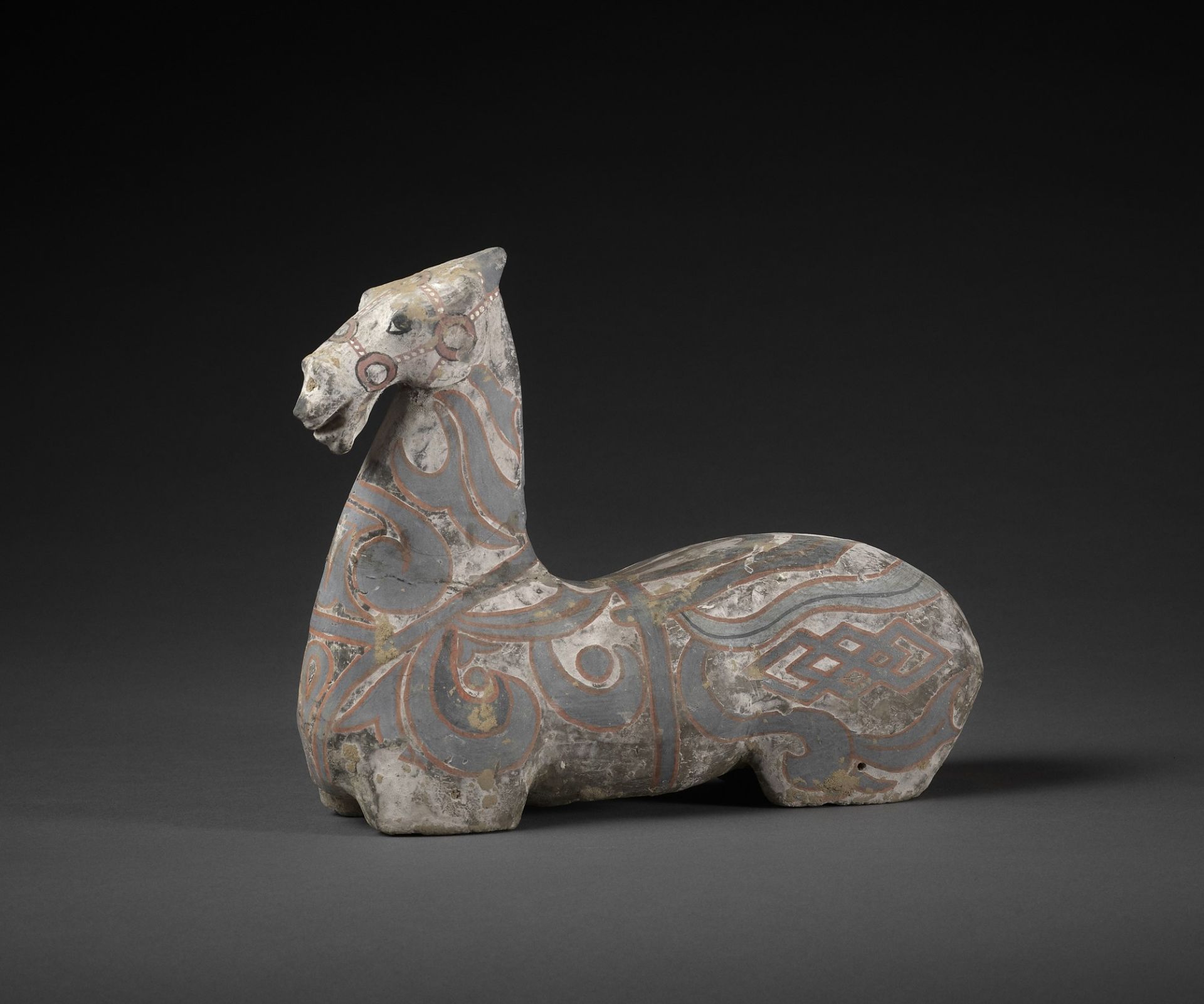 A FINELY PAINTED HAN DYNASTY MODEL OF A HORSE
