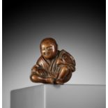 A CHARMING WOOD NETSUKE OF A RESTING FARMER