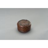 A WOVEN CIRCULAR COPPER AND BRASS BOX AND COVER