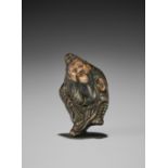 A GLAZED CERAMIC (YAKIMONO) NETSUKE OF SHOKI