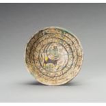 A NISHAPUR 'IBEX AND BEAST' POTTERY BOWL, 9TH - 10TH CENTURY