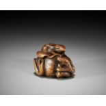 ARIMA TOMONOBU: A LARGE NAGOYA SCHOOL WOOD NETSUKE OF THE SANSUKUMI