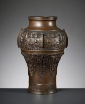 A MASSIVE BRONZE 'ARCHAISTIC' BALUSTER VASE, LATE MING TO EARLY QING