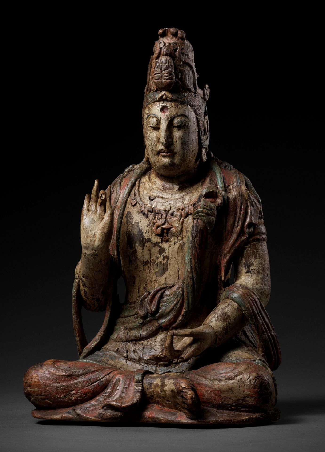 A POLYCHROME-PAINTED WOOD FIGURE OF GUANYIN, MING DYNASTY