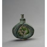 A BRONZE AND ENAMEL MINATURE FLASK