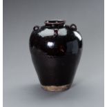 A LARGE AUBERGINE GLAZED MARTABAN STORAGE JAR