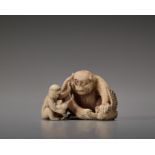 AN IVORY NETSUKE OF A MONKEY TEACHING HIS YOUNG BY SEIGYOKU