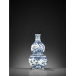 A BLUE AND WHITE 'THREE FRIENDS OF WINTER' DOUBLE-GOURD VASE, 17TH CENTURY