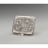 A SILVER REPOUSSE CIGARETTE CASE DEPICTING DRAGONS AND FARMERS