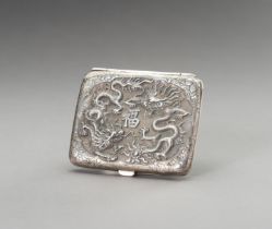 A SILVER REPOUSSE CIGARETTE CASE DEPICTING DRAGONS AND FARMERS