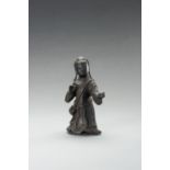 A BRONZE FIGURE OF A YOUTHFUL OFFICIAL, MING