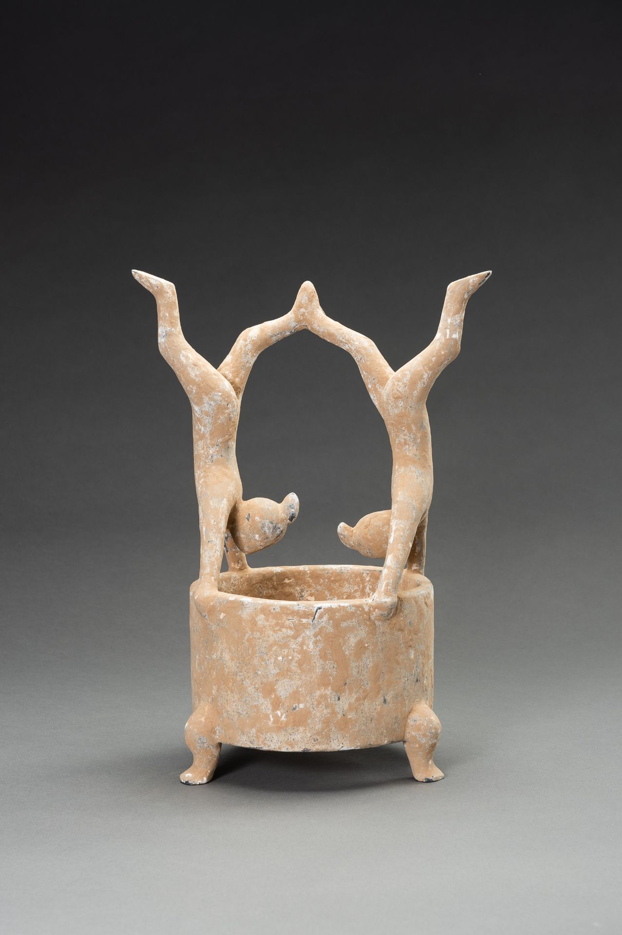 A POTTERY VESSEL WITH ACROBATS, HAN DYNASTY