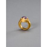 A LARGE KHMER GOLD RING WITH AMETHYST