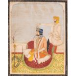 AN INDIAN MINIATURE PAINTING OF A RULER SMOKING A HUQQA