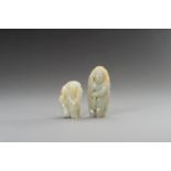 TWO CELADON AND RUSSET JADE FIGURINES, 1900s