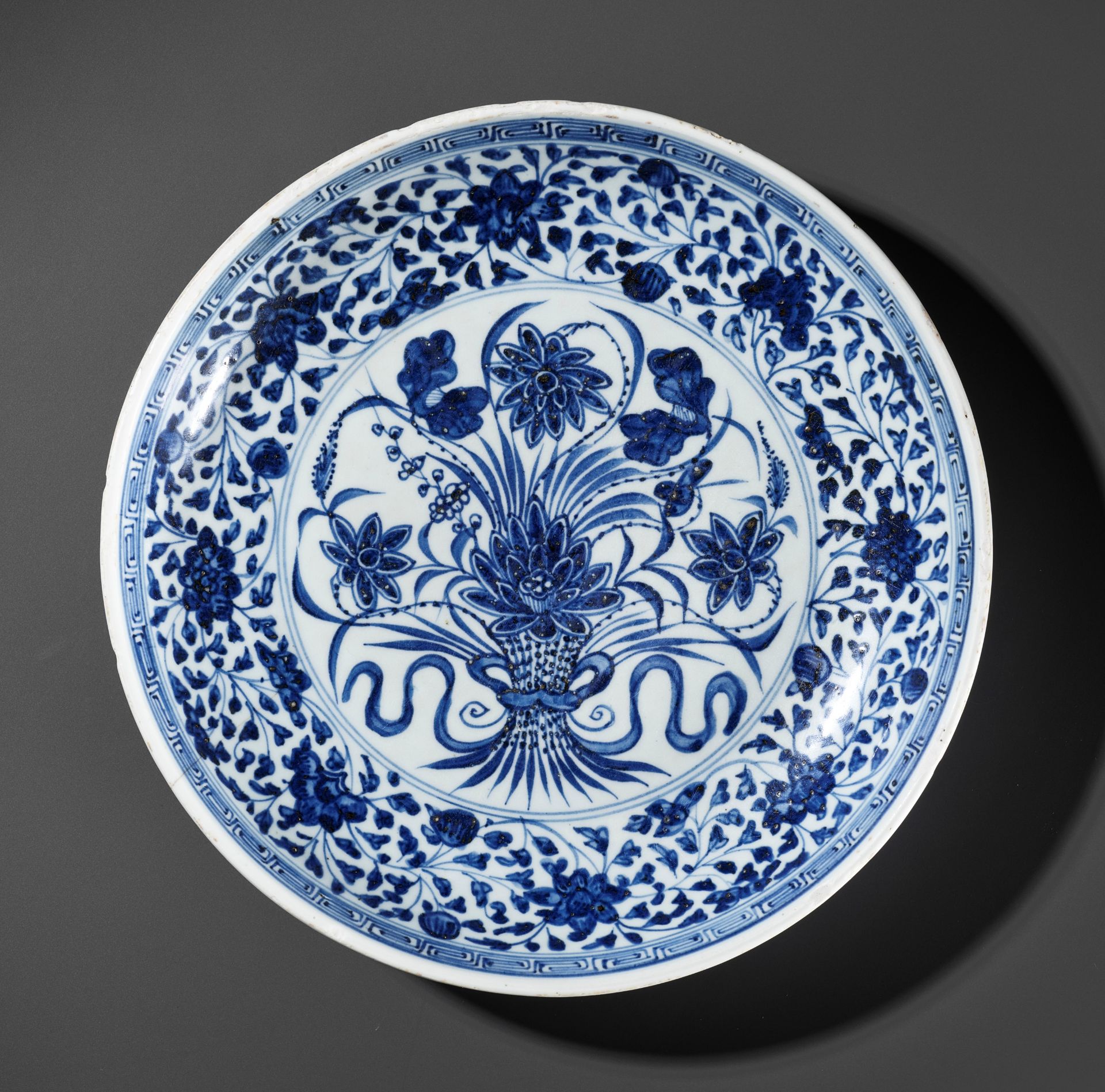 A MING-STYLE BLUE AND WHITE 'LOTUS BOUQUET' DISH, 18TH CENTURY