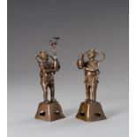 TWO BRONZE FIGURES OF BOYS HOLDING VASES