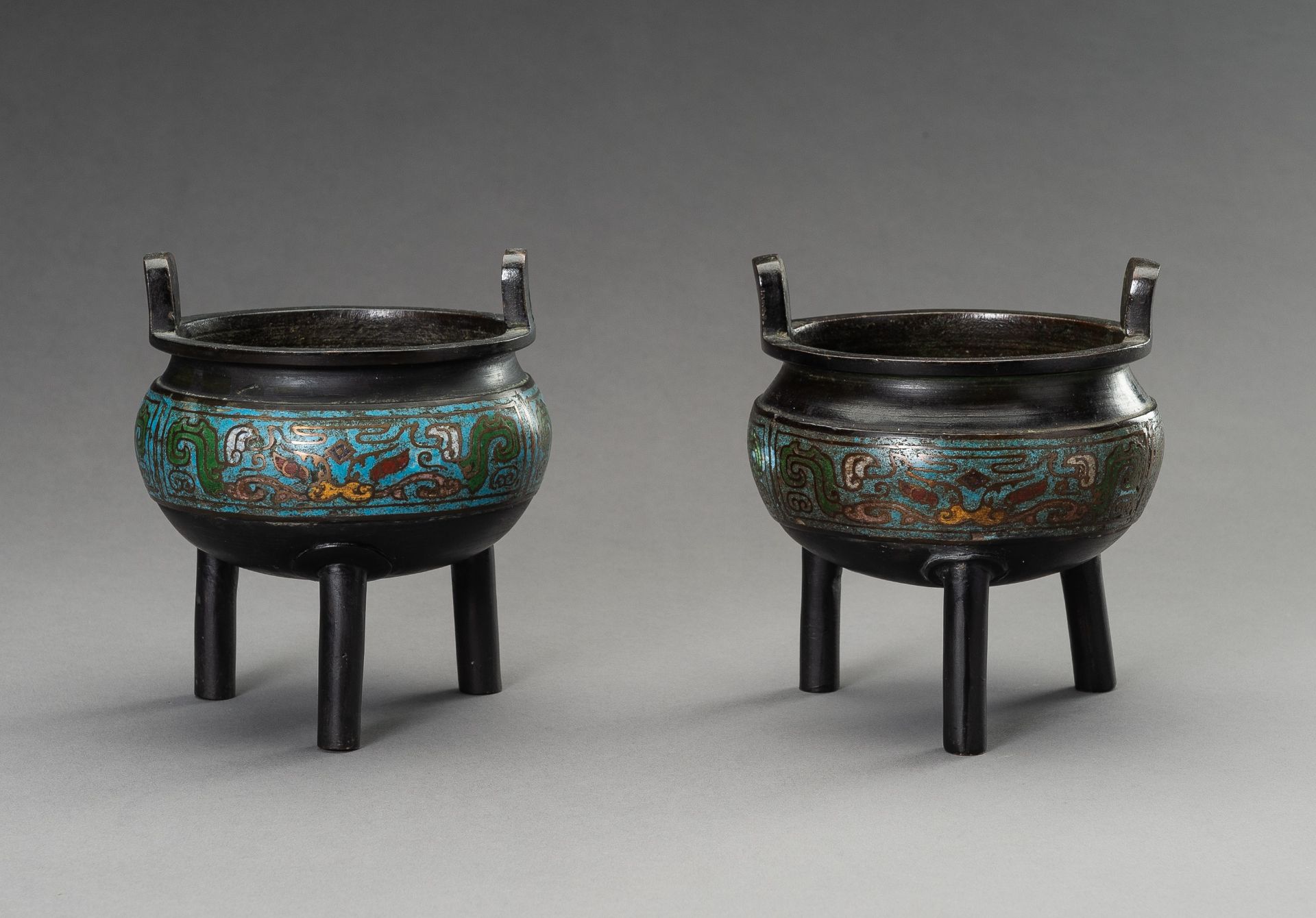 A PAIR OF CHAMPLEVE ENAMEL BRONZE TRIPOD CENSERS, QING DYNASTY