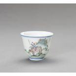 A 'BOY ON OX' PORCELAIN CUP, QING