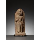 A SANDSTONE FIGURE OF A MALE DEITY, CHAM PERIOD